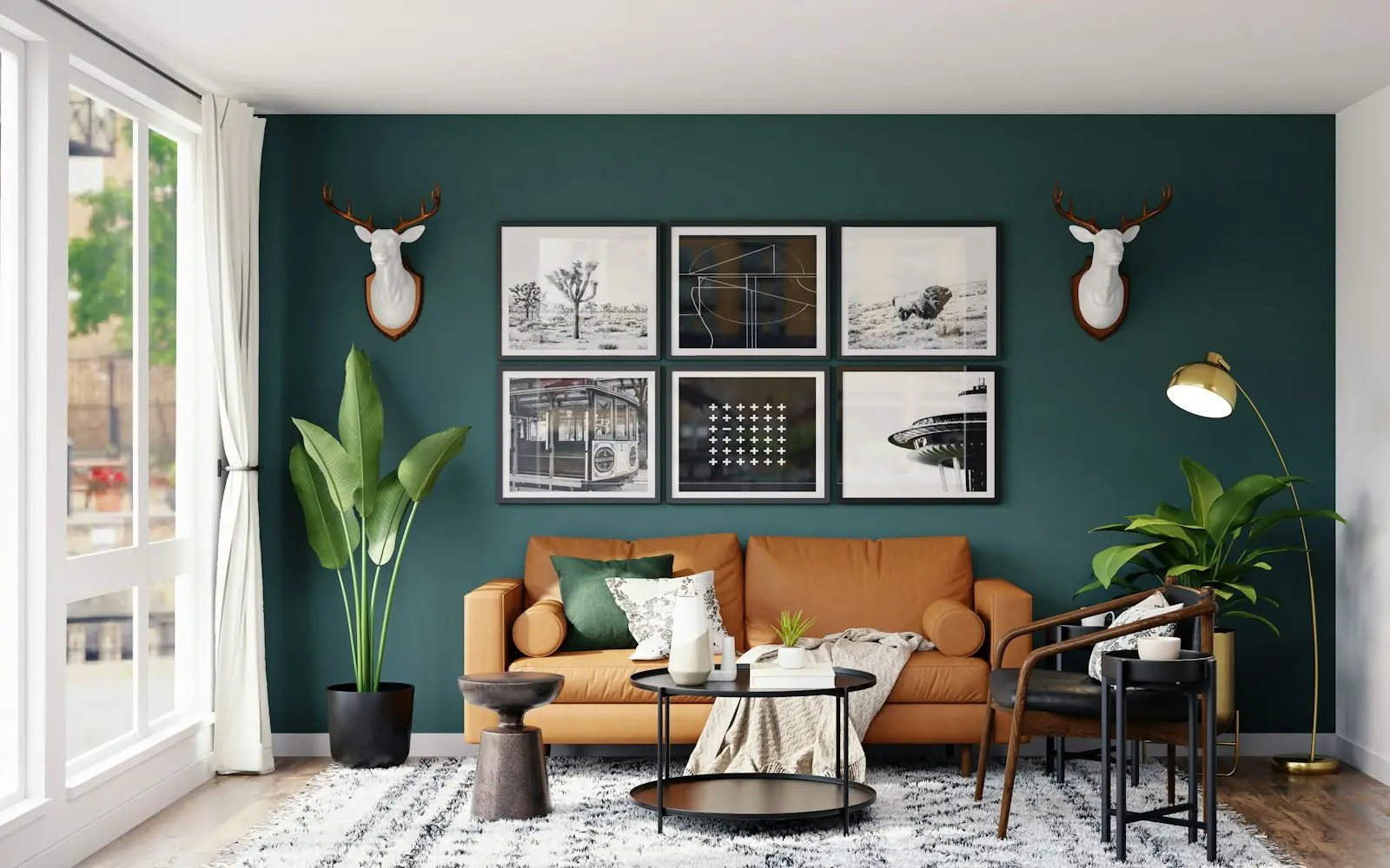 Living room with dark green wall, leather sofa and tall plants